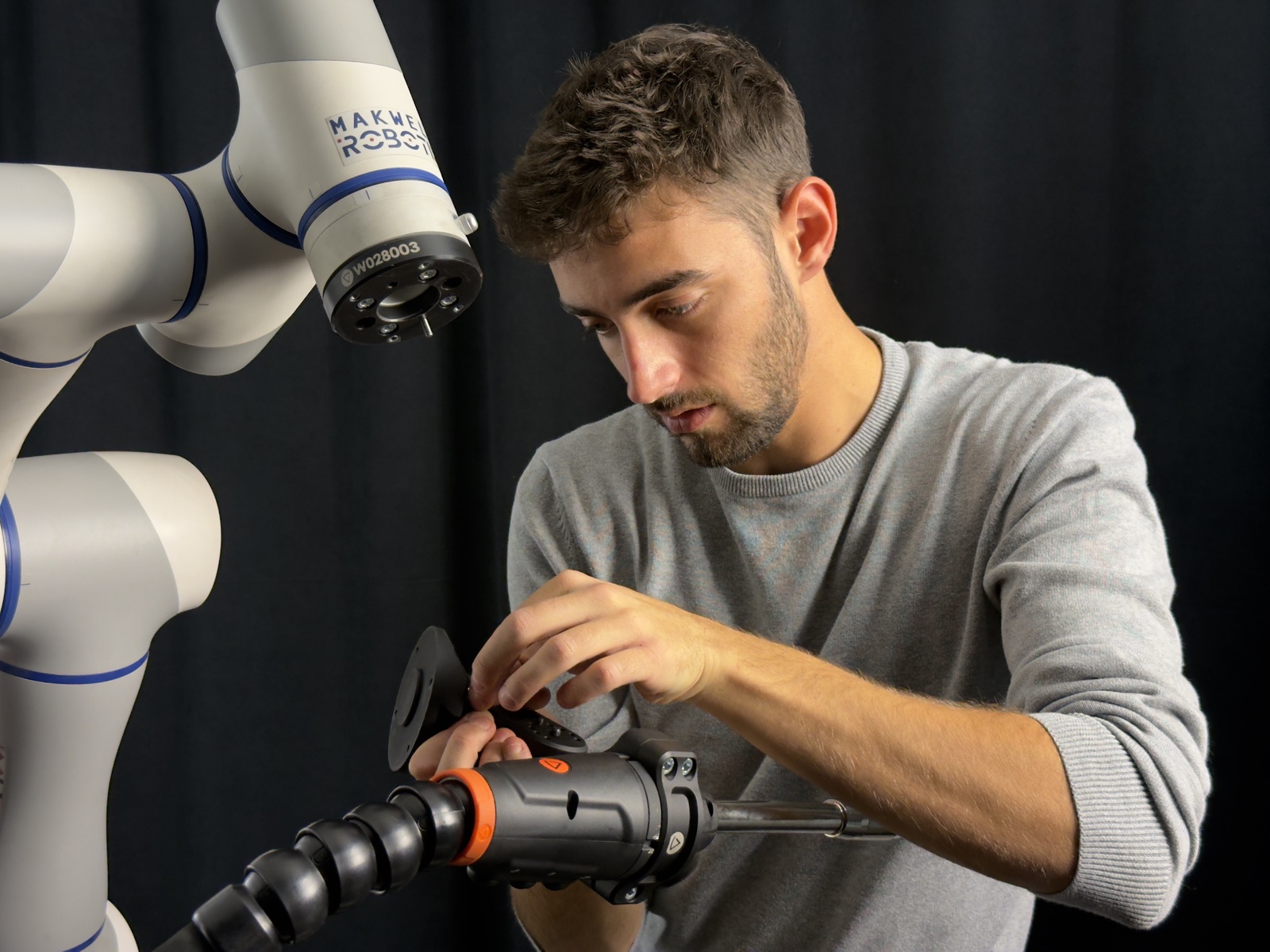 Technician setting up Makweld Robotix welding tool